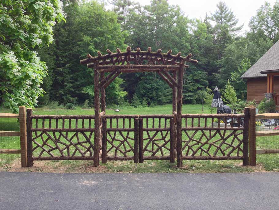 Branchwork rustic arbor constructed using natural materials titled the Paynter