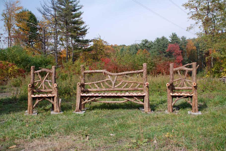 Outdoor rustic garden bench and chair set built using bark-on trees and branches titled the Haddem Chair & Bench Set