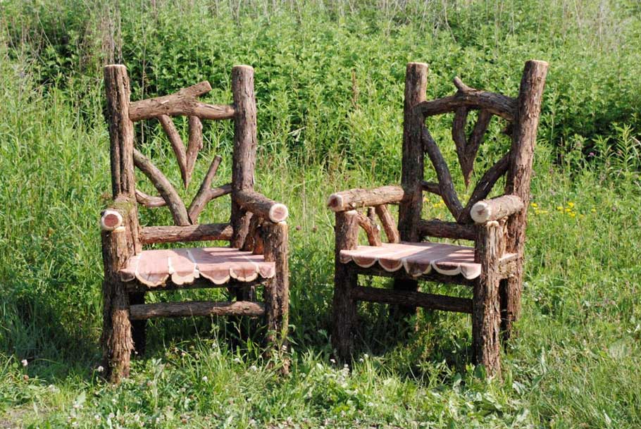 Outdoor rustic patio chairs built using bark-on trees and branches titled the Lamondo Chairs