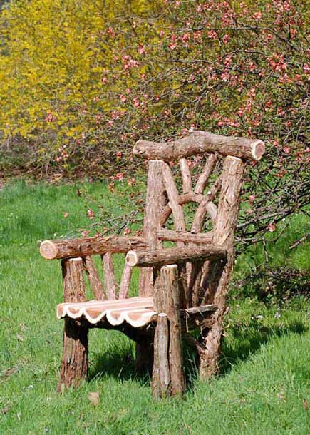 Outdoor rustic garden chair built using bark-on trees and branches titled the Gardener's Throne