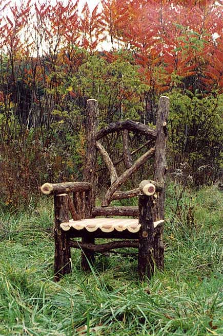 Rustic chair custom built using cedar trees and branches titled the Watershed Chair