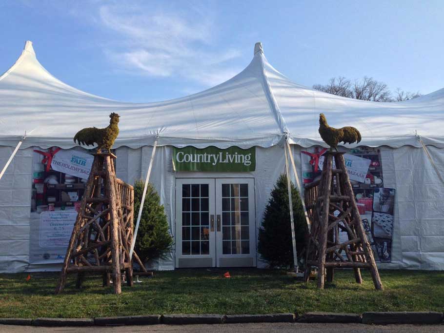 Natural wood obelisks built with trees and branches at the Country Living Fair