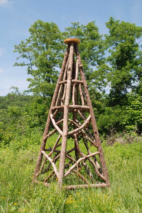 Outdoor obelisks in the rustic style using logs and branches titled Newtown Obelisk