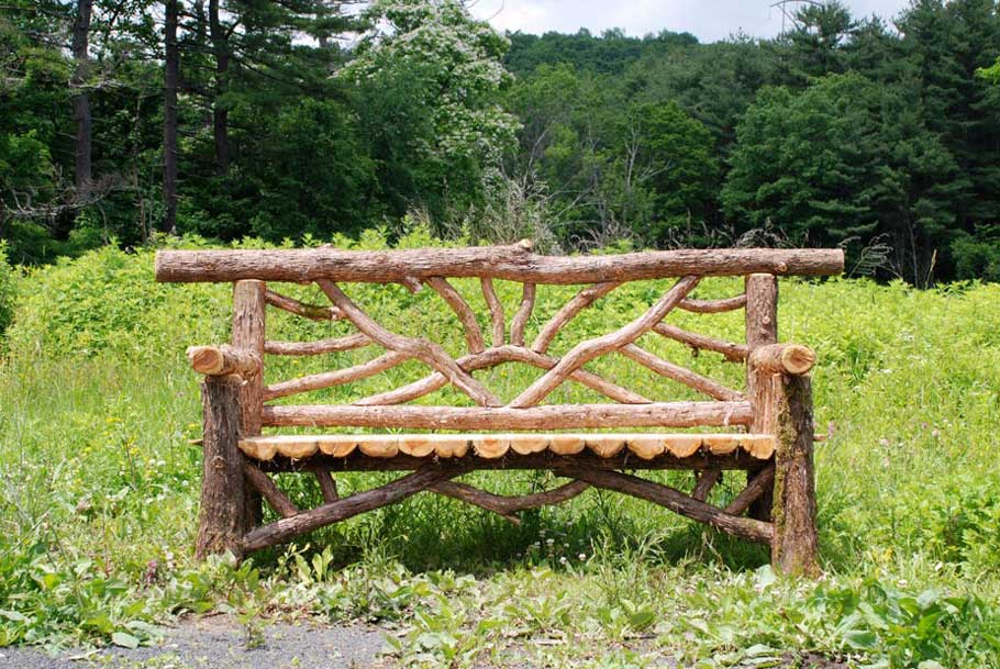 Exterior twig bench built from cedar logs titled the Catskill