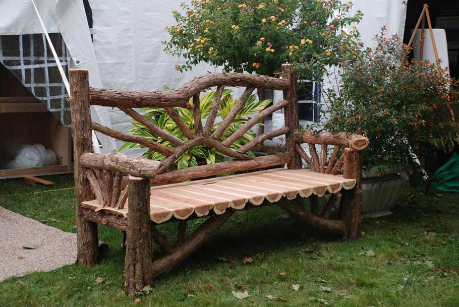 Exterior twig bench built from cedar logs titled the Millbrook Sunburst